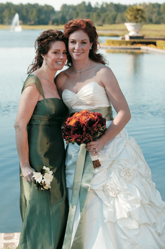 Sage Mother-of-the-Bride Dress
Photography: Mark Staff Photography
Read More:
http://www.insideweddings.com/weddings/autumn-inspired-golf-club-wedding-in-south-carolina/149/ Bride in ball gown with sage sash in front of lake with mother of bride in green dress