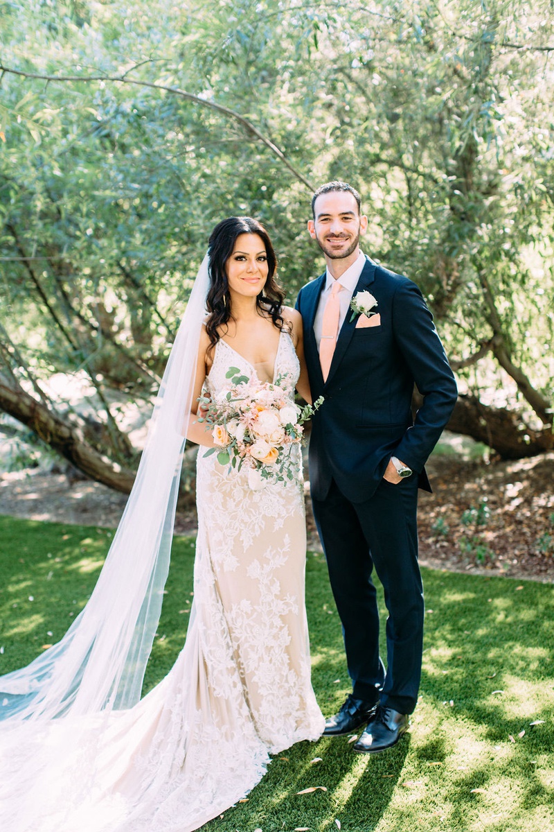 Nellie Ekmekjian %26 Jared Levy
Photography: Ashley Paige Photography
Read More:
http://www.insideweddings.com/weddings/elegant-outdoor-fall-wedding-at-a-rustic-chic-venue-in-malibu/1244/ bride in calla blanche wedding dress pastel bouquet cathedral veil groom in pink tie pocket square