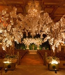 Lush Indoor Ceremony Décor
Photography: Ira Lippke Studios
Read More:
http://www.insideweddings.com/weddings/high-school-sweethearts-say-i-do-at-the-plaza-in-new-york-city/914/ The Plaza Hotel white flowers trees in ballroom ceremony space with chuppah canopy orchids