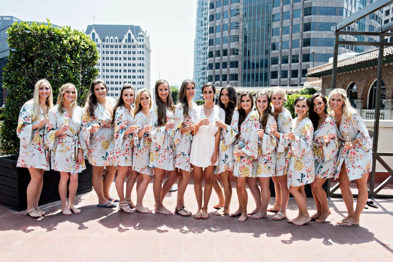 Rooftop Bridesmaids in Robes
Photography: Laurie Bailey Photography
Read More:
http://www.insideweddings.com/weddings/summer-soiree-with-lush-floral-elements-in-los-angeles-california/1170/ bride in white robe, bridesmaids in floral robes, large group of bridesmaids, getting ready shots,