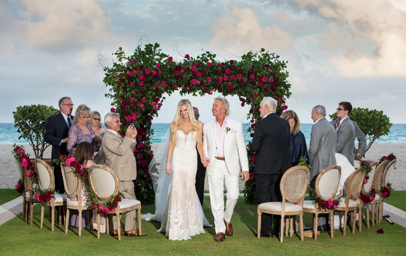 Intimate Guest List for Oceanfront Ceremony
Photography: Suzanne Delawar Studios
Read More:
http://www.insideweddings.com/weddings/intimate-oceanfront-wedding-with-romantic-red-pink-white-palette/1235/ wedding ceremony small guest list acqualina resort and spa green arch pink roses wood chairs round