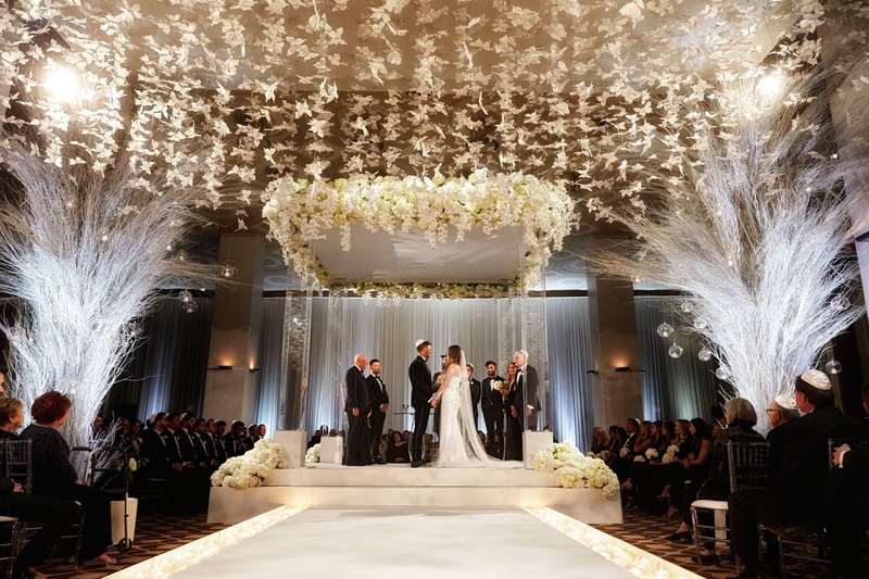 Winter White Chicago Wedding Ceremony
Photography: KingenSmith
Read More:
http://www.insideweddings.com/weddings/luxurious-wedding-featuring-sentimental-butterfly-decor-in-chicago/1348/ bride and groom standing under chuppah white decor butterfly lucite column