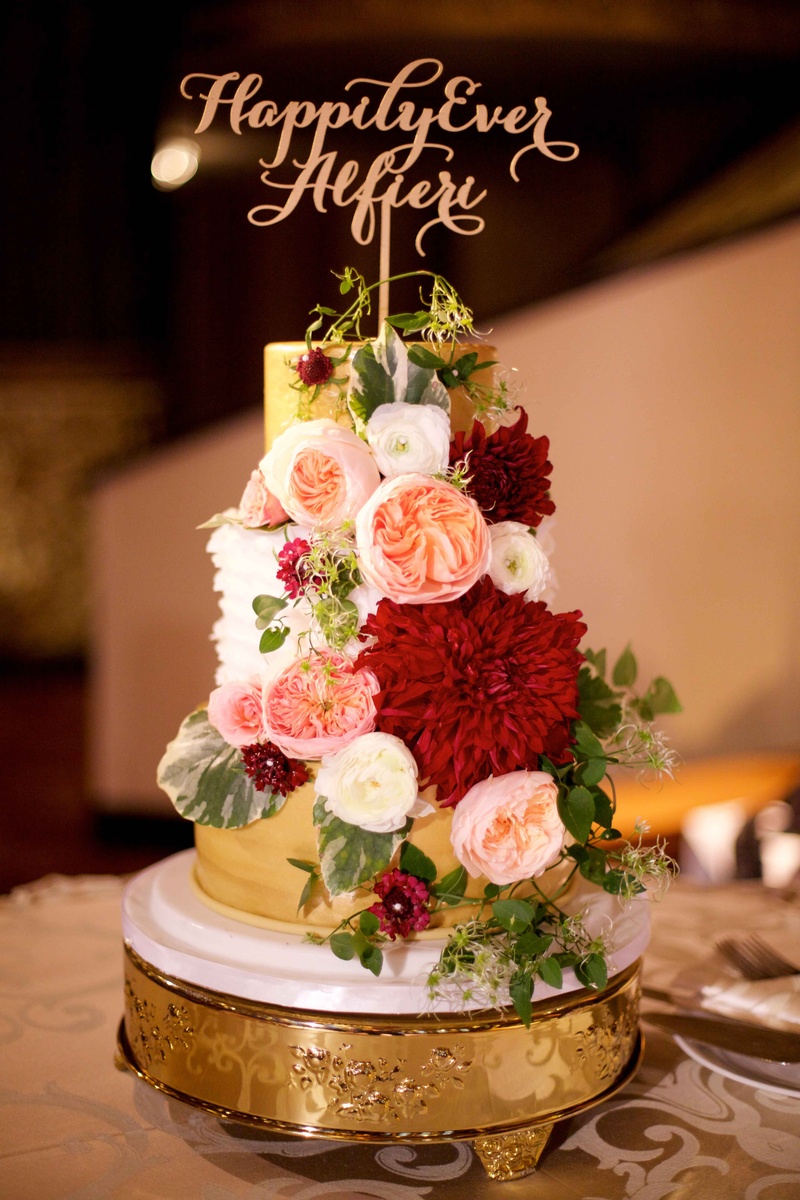 Cake with "Happily Ever After" Topper
Photography: Amanda Sudimack for Artisan Events
Read More:
http://www.insideweddings.com/weddings/customized-chicago-wedding-with-pink-blush-marsala-color-palette/911/ Wedding cake gold with white ruffle layer happily ever after cake topper and fresh flowers red blush