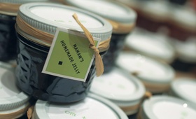 Homemade Jelly Favors
Photography: Sean Randall Photography
Read More:
http://www.insideweddings.com/weddings/producer-david-brauns-wedding-at-natural-history-museum-in-atlanta/198/ Jars of jam tied with raffia and green label