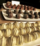 Chocolate Truffles
Photography: KingenSmith
Read More:
http://www.insideweddings.com/weddings/sophisticated-wedding-in-chicago-with-branch-succulent-decor/162/ White, milk, and dark chocolates on platters