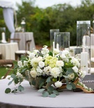 Low Cascading Floral Arrangement with Candles
Photography: Arden Photography
Read More:
http://www.insideweddings.com/weddings/chic-coastal-wedding-with-oyster-inspired-details-in-florida/850/ low floral cascading arrangement foliage white flowers wood votives round table