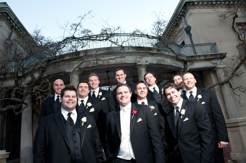 Groom and Groomsmen
Photography: Josh Lynn Photography
Read More:
http://www.insideweddings.com/weddings/purple-white-gold-new-jersey-celebration/339/ Groom in black tuxedo, white vest, red rose boutonniere with groomsmen in black tuxedos