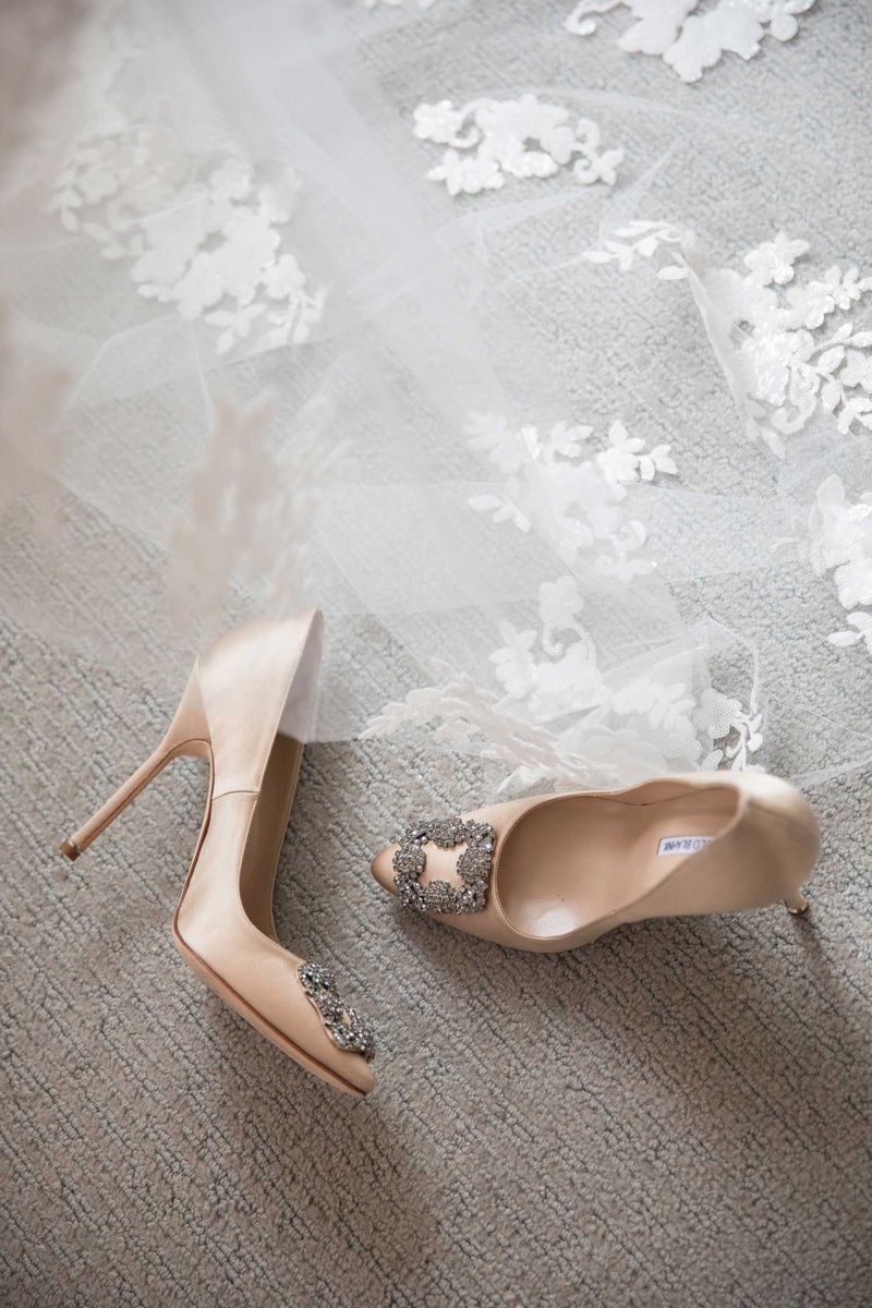 Pumps with Buckles at Toe
Photography: The Day by Ira Lippke
Read More:
http://www.insideweddings.com/weddings/opulent-luxury-wedding-with-timeless-color-palette-in-new-york-city/1199/ Manolo Blahnik nude wedding heels with crystal buckle detail at toe pumps ceil with flowers