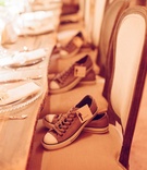 Dancing Shoe Favors
Photography: Elizabeth Messina
Read More:
http://www.insideweddings.com/weddings/an-earthy-elegant-eclectic-wedding-with-rustic-elements/390/ Comfortable sneakers for groomsmen with labels