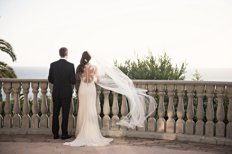 Couple Overlooks Oceanside Ceremony Site
Photography: Laurie Bailey Photography
Read More:
http://www.insideweddings.com/weddings/oceanfront-wedding-ceremony-classic-romantic-ballroom-reception/854/ couple overlooks oceanside ceremony site flowing veil wedding black tuxedo white dress pacific