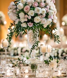 Classic Peony and Rose Tall Centerpiece
Photography: Kent Drake Photography
Read More:
http://www.insideweddings.com/weddings/greek-orthodox-ceremony-romantic-ballroom-reception-in-chicago/1334/ tall wedding reception centerpiece white pink rose peony flowers with greenery crystal vase candles