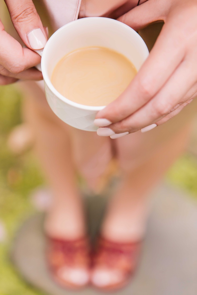 Painted Nails and a Cup of Coffee
Photography: Vue Photography
Read More:
http://www.insideweddings.com/weddings/baroque-autumn-wedding-with-deep-wine-tones-in-north-carolina/770/ bridesmaid with cream painted nails displays a cup of coffee while getting ready