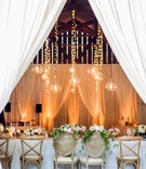 Romantic Drapery %26 Pendants
Photography: Willa Kveta Photography
Read More:
http://www.insideweddings.com/weddings/alfresco-ceremony-by-the-beach-elegant-barn-wedding-reception/1298/ wedding reception in barn with drapery twinkle lights and pendant orbs cane chairs wood vineyard x