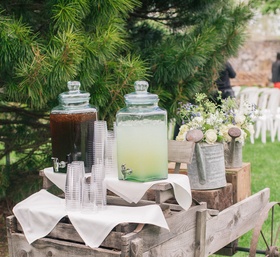 Lemonade and Iced Tea Wagon
Photography: Kelly Kollar Photography
Read More:
http://www.insideweddings.com/weddings/alfresco-ceremony-romantic-tented-reception-in-new-jersey/594/ Antique cart with glass drink canisters and cups