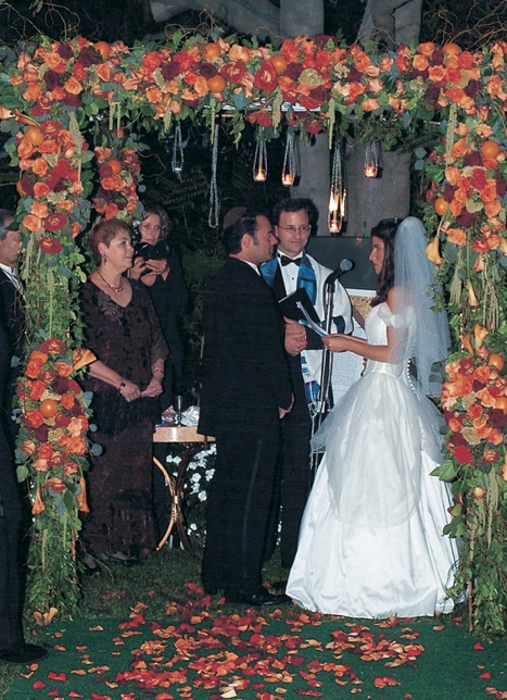 Chuppah of Orange and Green Flowers
Photography: Simone %26 Martin Photography
Read More:
http://www.insideweddings.com/weddings/a-midsummer-nights-dream-wedding-in-beverly-hills-california/58/ ceremony under chuppah decorated with orange flowers and greenery