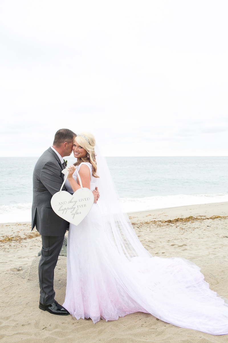 Pink %26 White Wedding Dress
Photography: Marianne Lozano Photography
Read More:
http://www.insideweddings.com/weddings/pink-white-wedding-with-ombre-details-at-montage-laguna-beach/686/ Bride and groom on beach with heart shaped sign