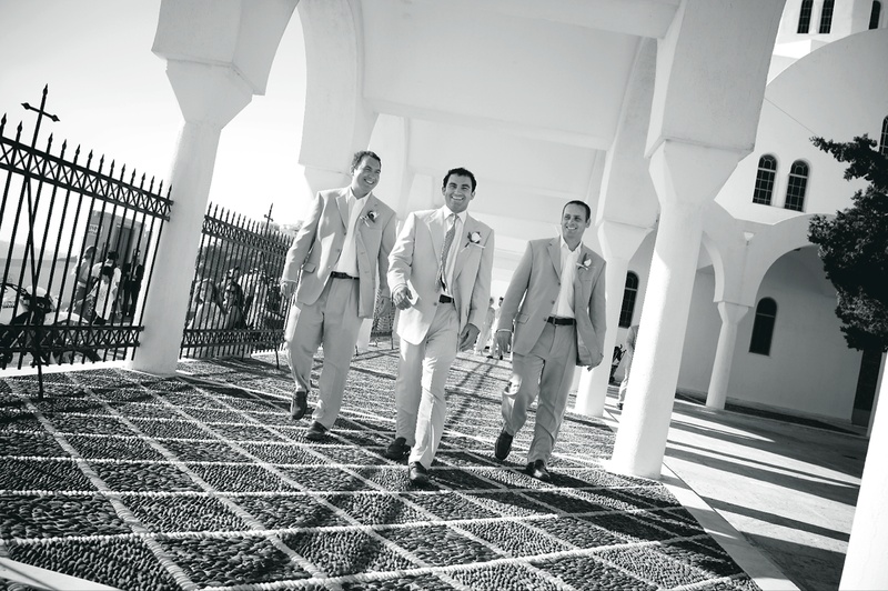 The Groom and His Groomsmen
Photography: Mark Nixon Photographer
Read More:
http://www.insideweddings.com/weddings/destination-wedding-on-the-greek-island-of-santorini/207/ Black and white photo of men outside in Santorini