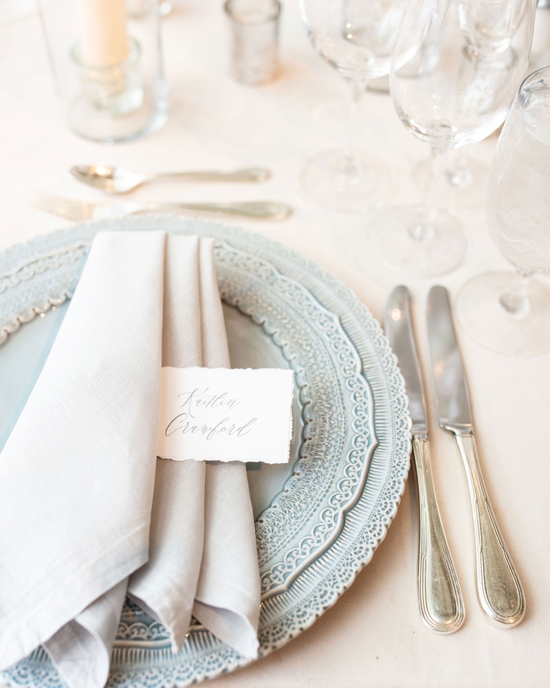 French-Inspired Place Setting
Photography: Mantas Kubilinskas Photography
Read More:
http://www.insideweddings.com/weddings/sophisticated-ceremony-ballroom-reception-in-washington-dc/1296/ wedding reception place setting light blue charger plate light grey napkin torn place card