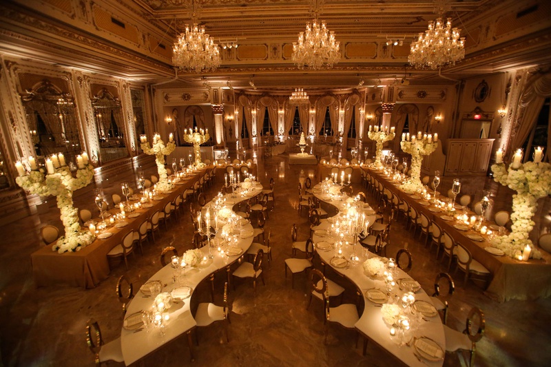 Aerial View of Opulent Ballroom Wedding
Photography: Alain Martinez Photography
Read More:
http://www.insideweddings.com/weddings/opulent-luxury-wedding-with-white-gold-color-scheme-in-palm-beach/1375/ wedding reception at the mar a lago club florida s serpentine tables long table perimeter chandelier