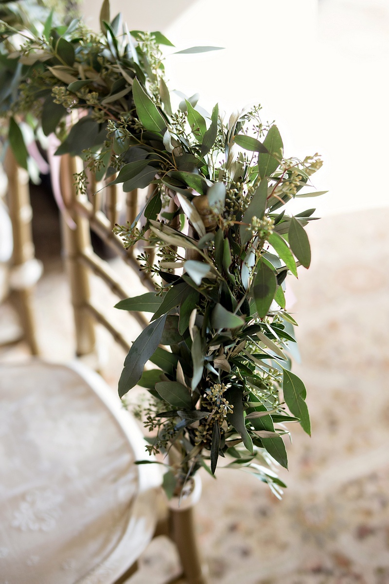 Verdant Garland on Chair Back
Photography: Laurie Bailey Photography
Read More:
http://www.insideweddings.com/weddings/oceanfront-wedding-ceremony-classic-romantic-ballroom-reception/854/ eucalyptus garland on back of gold chiavari chair, wedding sweetheart table