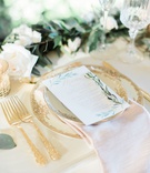 Place Setting with Ornate Gold Flatware
Photography: Ether %26 Smith
Read More:
http://www.insideweddings.com/weddings/organic-glam-vintage-inspired-real-wedding-in-california/1180/ wedding reception table setting white menu card herb design gold forks flatware wood table