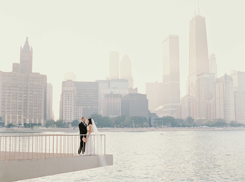 Couples Portrait with View of Chicago
Photography: Amanda Sudimack for Artisan Events
Read More:
http://www.insideweddings.com/weddings/customized-chicago-wedding-with-pink-blush-marsala-color-palette/911/ Bride and groom on ledge over river in Chicago with skyline in background