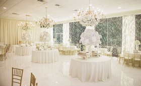White %26 Gold NYE Wedding
Photography: Sarah Kate, Photographer
Read More:
http://www.insideweddings.com/weddings/traditional-catholic-ceremony-festive-new-years-eve-reception/1051/ Ballroom white and gold wedding reception decor white flower arrangements gold chairs chandeliers