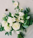 White, Ivory + Green Bouquet
Photography: Carrie King Photography
Read More:
http://www.insideweddings.com/weddings/chic-winter-wedding-at-a-church-industrial-artsy-venue-in-denver/1289/ weedding bouquet greenery leaves white roses dahlia flowers wrapped with ribbon exposed stems