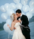 Newlyweds Holding Balloons
Photography: Jessica Claire Photography
Read More:
http://www.insideweddings.com/weddings/sentimental-ceremony-tented-reception-in-maryland/203/ bride and groom kiss while holding balloons