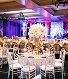 Lush Centerpiece on Tall Gold Vase
Photography: John Cain Photography
Read More:
http://www.insideweddings.com/weddings/rustic-fall-nuptials-with-custom-details-in-beaver-creek-colorado/1204/ ivory flowers on thick gold vase, textured cream linens, white chairs