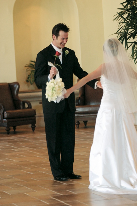 Groom Admires His Bride
Photography: Karen French Photography
Read More:
http://www.insideweddings.com/weddings/romantic-winter-wedding-in-huntington-beach-california/81/ Couple's First Look in resort lobby