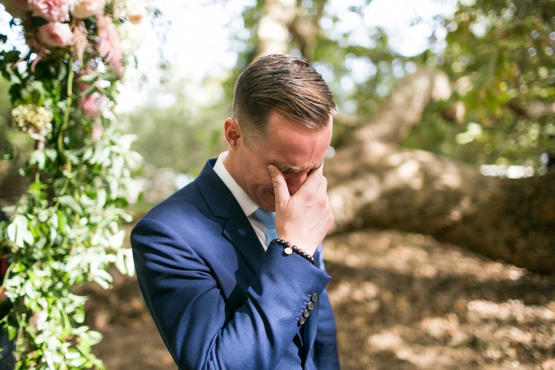Groom Holding Back Tears at Ceremony
Photography: Samuel Lippke Studios
Read More:
http://www.insideweddings.com/weddings/a-rustic-camp-themed-outdoor-wedding/908/ Groom in navy blue suit holding back tears crying at outdoor wedding ceremony