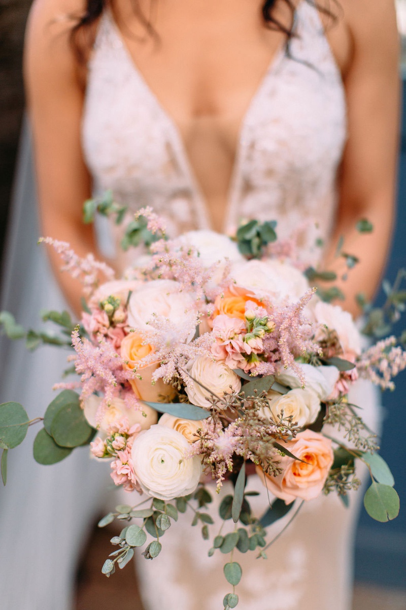 Pink %26 Peach Bridal Bouquet
Photography: Ashley Paige Photography
Read More:
http://www.insideweddings.com/weddings/elegant-outdoor-fall-wedding-at-a-rustic-chic-venue-in-malibu/1244/ bride with plunging neckline holding bouquet pastel pink and orange pink white ranunculus rose