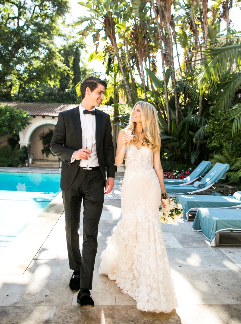 Poolside Couple with Champagne
Photography: Samuel Lippke Studios
Read More:
http://www.insideweddings.com/weddings/tuscany-meets-rustic-california-outdoor-wedding-under-the-stars/1336/ wedding portrait bride and groom at hotel bel-air pool with flute of champagne california wedding