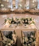 Sweetheart Table Overlooking Dance Floor
Photography: Jillian Rose Photography
Read More:
http://www.insideweddings.com/weddings/indoor-wedding-with-beach-inspired-color-palette-in-santa-monica/1052/ sweetheart table in front of round dance floor, chiavari chairs with blue fabric and florals