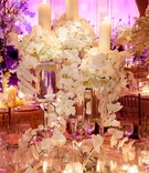 Table Décor
Photography: Gruber Photographers
Read More:
http://www.insideweddings.com/weddings/fairy-tale-ballroom-wedding-in-new-york-city/414/ Wedding reception table with arrangements of white flowers and pillar candles