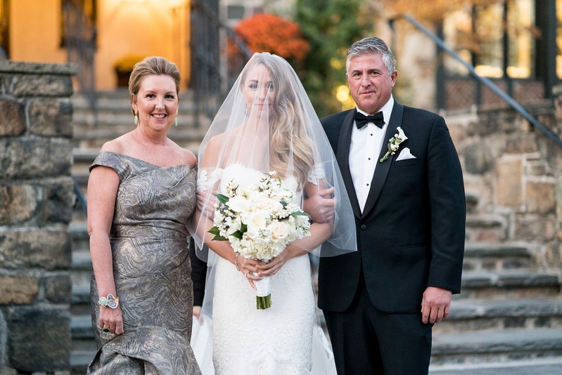 Mother of Bride in Off-Shoulder Gown
Photography: Robert Evans for 5th Avenue Digital
Read More:
http://www.insideweddings.com/weddings/outdoor-jewish-wedding-ceremony-at-stunning-chateau-in-new-jersey/1058/ Bride in anne barge wedding dress off shoulder with father of bride tuxedo and mother in grey gown