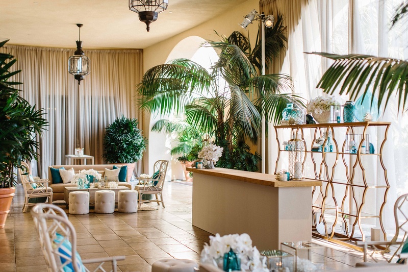 Beachy Cocktail Hour Décor
Photography: Braedon Photography
Read More:
http://www.insideweddings.com/weddings/orthodox-jewish-wedding-with-outdoor-ceremony-inspired-by-the-sea/812/ Wedding reception cocktail hour lounge tropical beach theme with blue decor wicker chairs ottomans