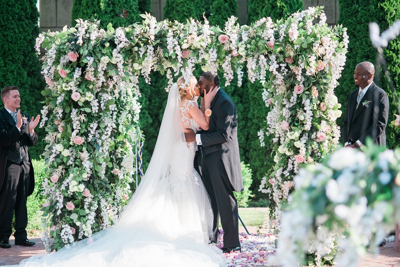 Fairy-Tale Kiss
Photography: Keith + Melissa Photography
Read More:
http://www.insideweddings.com/weddings/magical-fairy-tale-wedding-fit-for-a-princess-at-a-castle-venue/1293/ bride in galia lahav bridal gown kissing groom under lush ceremony arbor, donathan hurley survivor