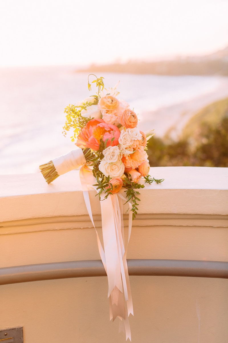 Sunset Photo of Wedding Bouquet
Photography: Ashley Paige Photography
Read More:
http://www.insideweddings.com/weddings/romantic-ocean-view-ceremony-charming-reception-in-california/1337/ sunset photo of bridal bouquet hot pink peony white orange roses ranunculus greenery