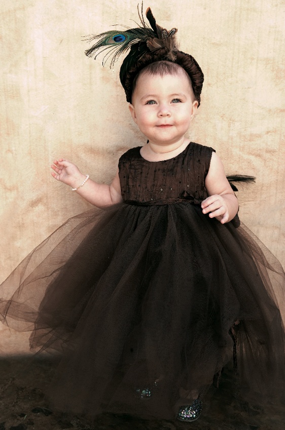 Unique Flower Girl Attire
Photography: Tony Florez Photography
Read More:
http://www.insideweddings.com/weddings/peacock-feather-themed-wedding-in-santa-barbara-california/166/ Brown dress with headband and feathers