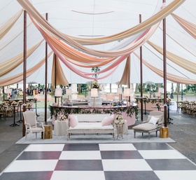 Sailcloth Tent with Drapery %26 Dance Floor
Photography: Liz Banfield
Read More:
http://www.insideweddings.com/weddings/destination-fete-with-chapel-ceremony-charming-tented-reception/1179/ Wedding reception tent checkerboard dance floor lounge furniture wood chairs linen tables bar