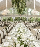 Long Mirror-Top Table, Floral Fixture Above
Photography: Annette Navarro
Read More:
http://www.insideweddings.com/weddings/romantic-garden-wedding-with-white-green-motif-in-cincinnati/959/ long mirror top table floral fixture above wicker runner modern tented reception wedding garden