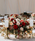 Burgundy Blooms %26 Gold Décor
Photography: Grant Daniels Photography
Read More:
http://www.insideweddings.com/weddings/outdoor-ceremony-tented-reception-with-cozy-fall-color-palette/1183/ wedding reception low centerpiece table with gold acrylic table number candlestick succulent blush