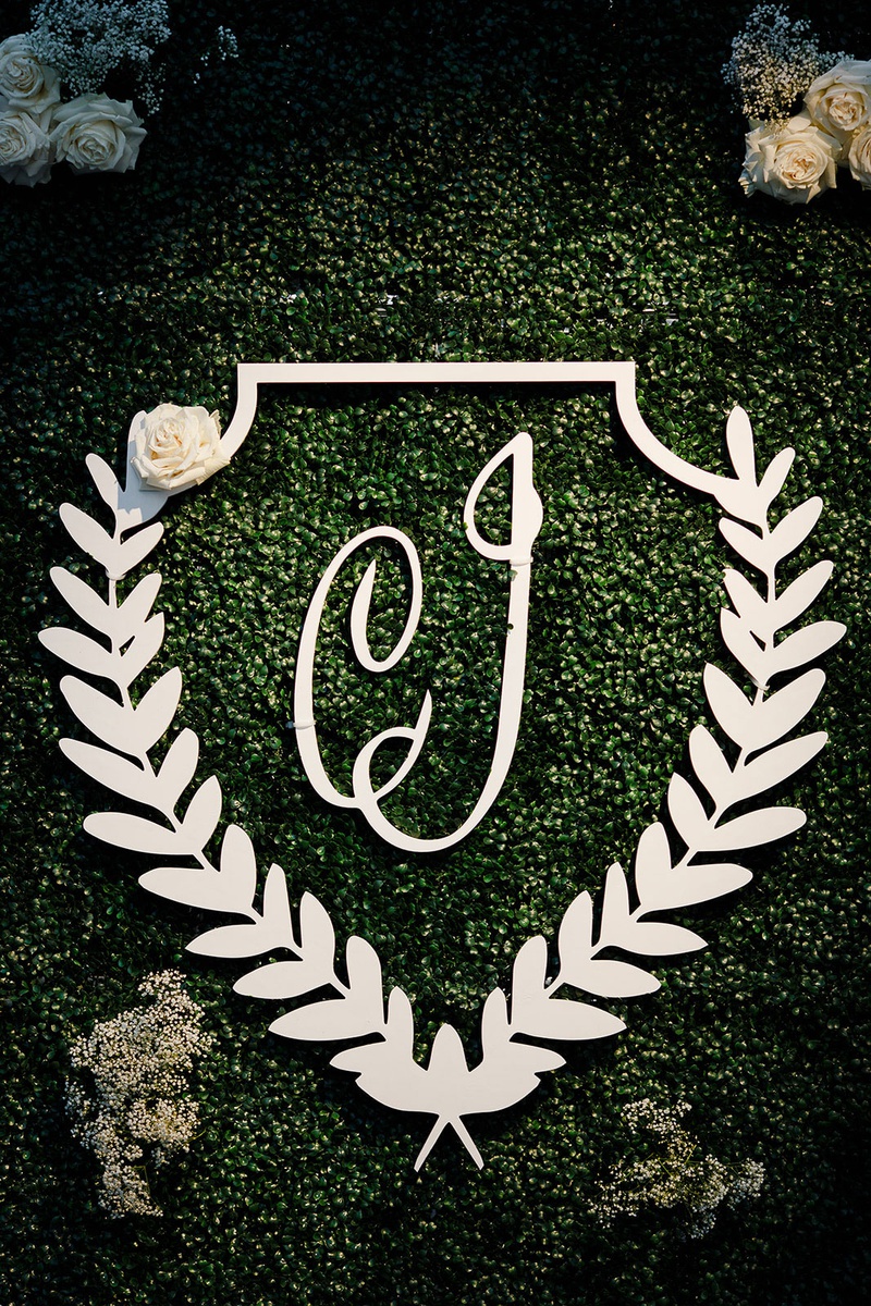 Laurel Wreath Monogram on Hedge Wall
Photography: Studio This Is
Read More:
http://www.insideweddings.com/weddings/traditional-catholic-ceremony-classic-country-club-reception/1360/ wedding reception greenery hedge wall laurel wreath monogram white flowers seating chart welcome