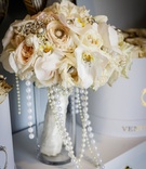 Adorned Bridal Bouquet
Photography: Amy Anaiz Photography
Read More:
http://www.insideweddings.com/weddings/regal-style-mansion-wedding-with-black-and-gold-color-palette/1046/ bridal bouquet with orchids, beige roses, pearl and brooch details