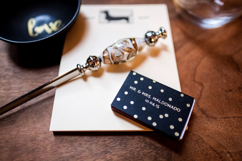 Personalized Matchbook with Polka Dots
Photography: Joe Photo
Read More:
http://www.insideweddings.com/weddings/the-unique-and-intimate-wedding-of-trains-bassist-hector-maldonado/879/ hector maldonado train wedding matchbook black with gold polka dots and wedding date
