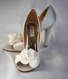 White Wedding Pumps
Photography: Donat Photography
Read More:
http://www.insideweddings.com/weddings/enuka-okuma-and-joe-gasparik/380/ Badgley Mischka white wedding heels with flower