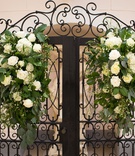 Arrangements on Gate
Photography: D2 Photography
Read More:
http://www.insideweddings.com/weddings/luxurious-italian-inspired-destination-wedding-in-las-vegas/1194/ black gate with white flowers and greenery to serve as backdrop of ceremony
