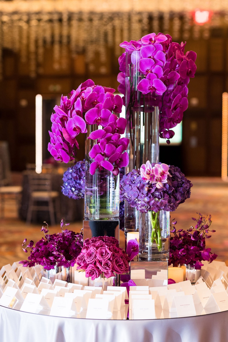Vibrant Escort Card Table
Photography: Brian Leahy Photography
Read More:
http://www.insideweddings.com/weddings/a-hawaiian-couples-luxurious-destination-wedding-in-las-vegas/1226/ escort card table with fuchsia flowers, orchids, purple orchids
